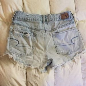Size 2 light wash slightly torn daisy dukes
